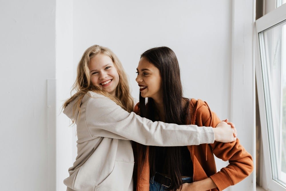 Love bombing in friendship is a real thing, and this is what it looks like