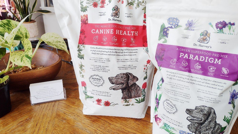 I'm sharing my story on why I stopped feeding my dog kibble, the alternatives and their pros and cons. (In this photo: Dr. Harvey's Canine Health and Paradigm)